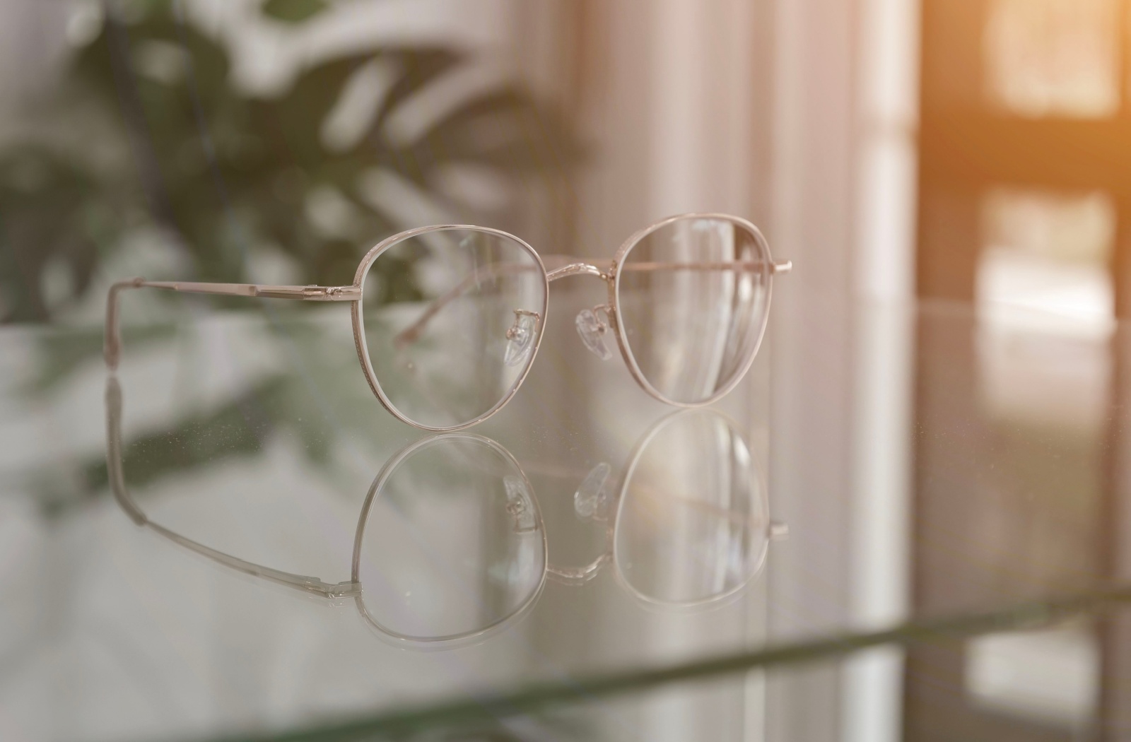 a pair of progressive eyeglasses on a glass counter top